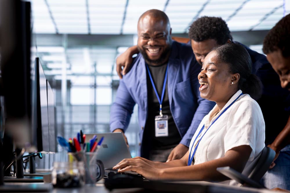 Happy team collaborating in a modern office environment